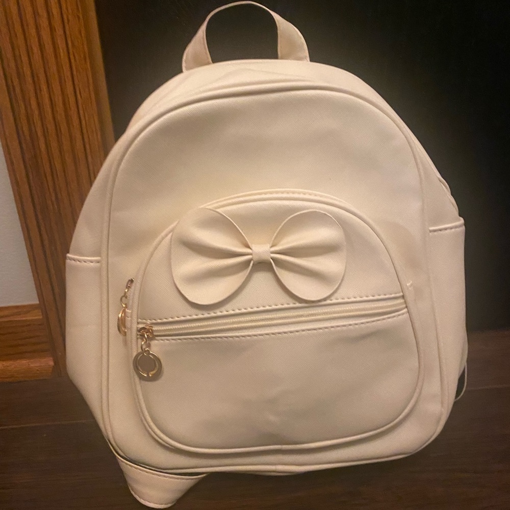 Cream purse backpack